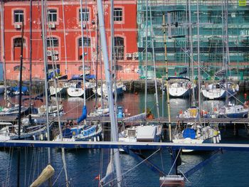 Boats moored at harbor