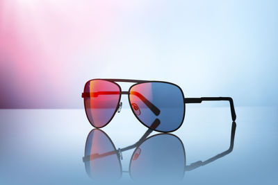 Close-up of sunglasses against clear sky