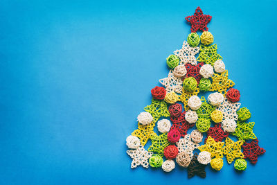 Close-up of christmas decorations on blue background