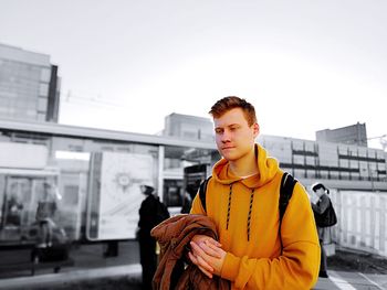 Young man against sky during winter