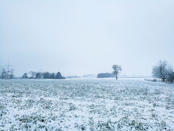 Scenic view of snow field against clear sky