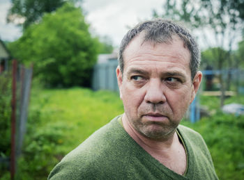 Close-up of serious mature man looking away