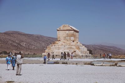 Low angle view of old ruins against blue sky