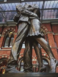 Low angle view of statue against building