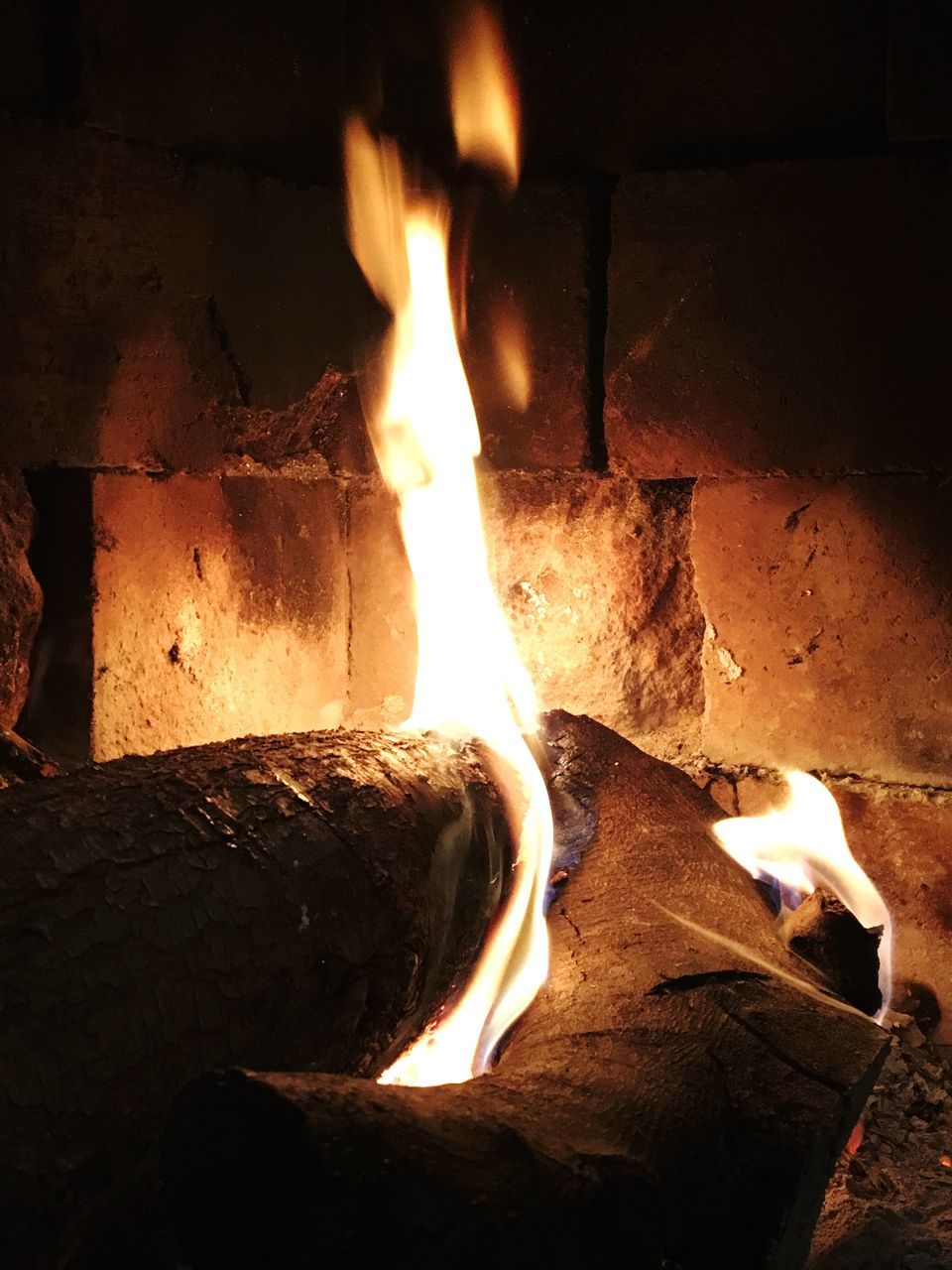 CLOSE-UP OF FIRE BURNING AT HOME