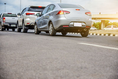 Cars moving on road against sky