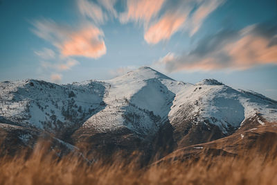 Scenic view of snowcapped mountains against sky