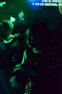 Young woman dancing in nightclub