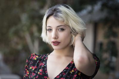 Portrait of beautiful young woman outdoors