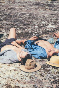 High angle view of man relaxing on beach