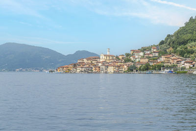 Landscape of the lakeside of peshiera maraglio in monte isola with beautiful colored houses 