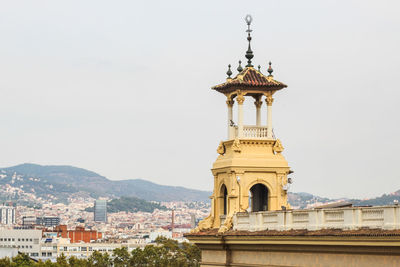 Tower amidst buildings against sky