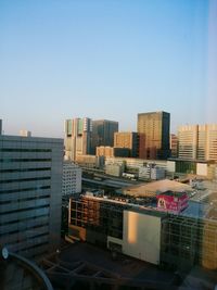 Cityscape against clear sky