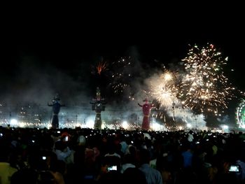 People enjoying music concert at night