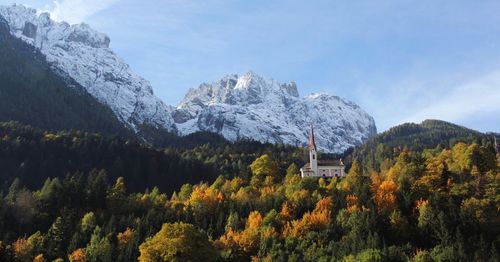 Scenic view of snowcapped mountains against sky