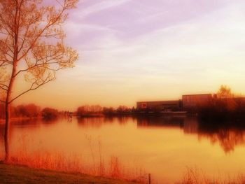 Scenic view of calm lake at sunset