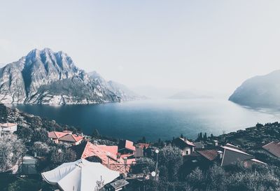 Panoramic view of buildings and mountains against sky