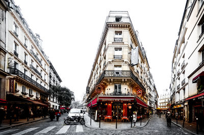 City street and buildings against sky