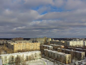 Buildings in city against sky