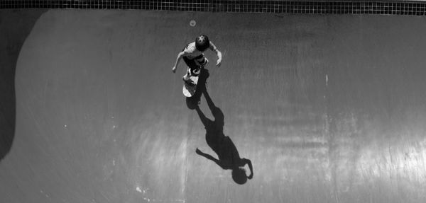 High angle view of woman surfing in swimming pool