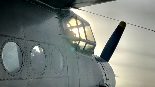 Old military propeller airplane against sky