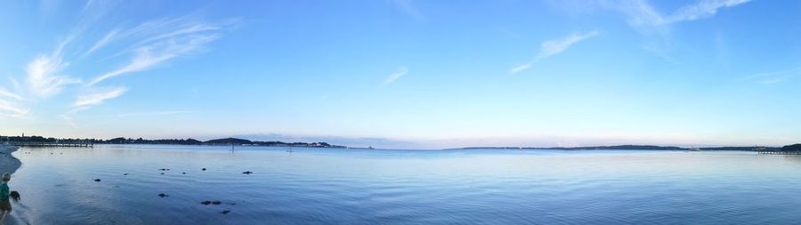 Panoramic view of lake against blue sky