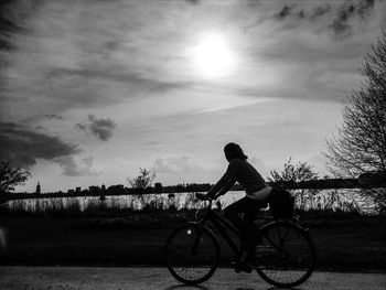 People riding bicycle on road