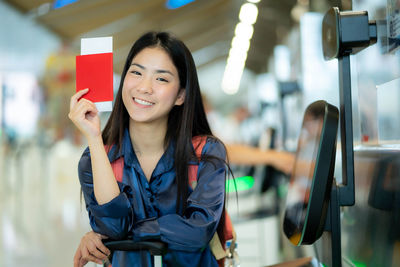 Portrait of young woman standing in gym