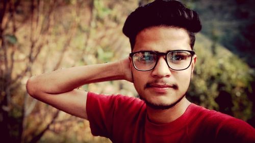 Portrait of young man wearing eyeglasses