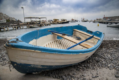 Boat moored at harbor