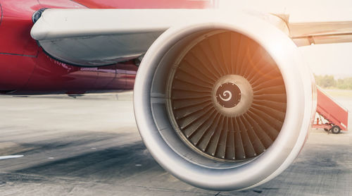 Close-up of airplane at airport runway