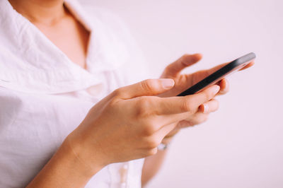 Midsection of woman using mobile phone