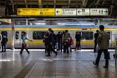 People at railroad station platform