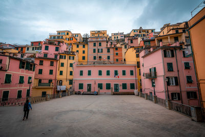 Buildings in city against sky