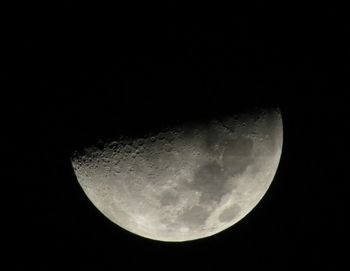 Close-up of half moon at night