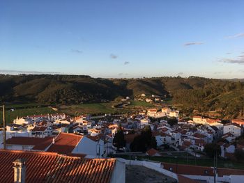 Town against clear blue sky