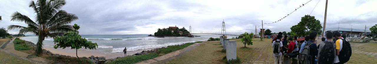 sea, beach, sky, water, cloud - sky, panoramic, nature, tree, sand, day, outdoors, horizon over water, beauty in nature, palm tree, no people, nautical vessel, architecture