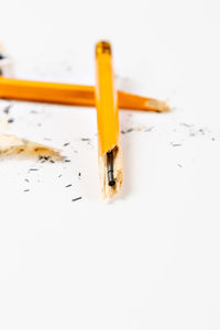 High angle view of pencils on white table