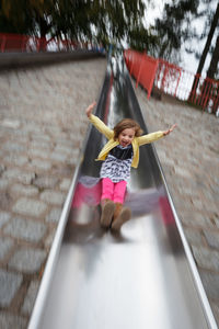 Playful girl playing on playground