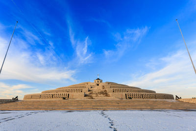 Low angle view of historical building against blue sky