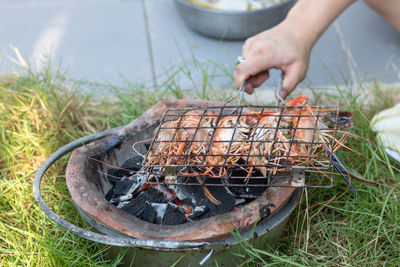 Man preparing food on barbecue grill