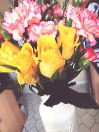 Close-up of yellow flowers in vase