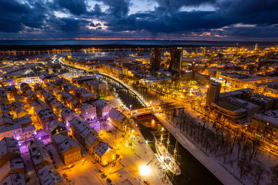 Aerial winter snowy night view of klaipeda old town, lithuania