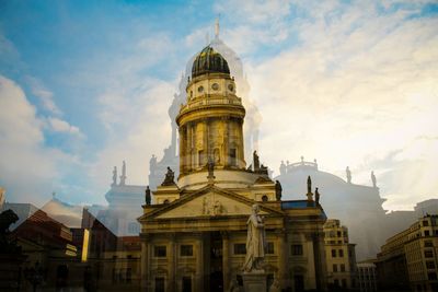 Low angle view of cathedral against cloudy sky