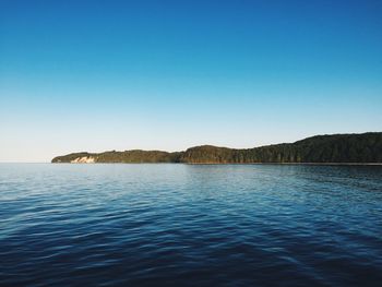 Scenic view of calm sea against clear sky