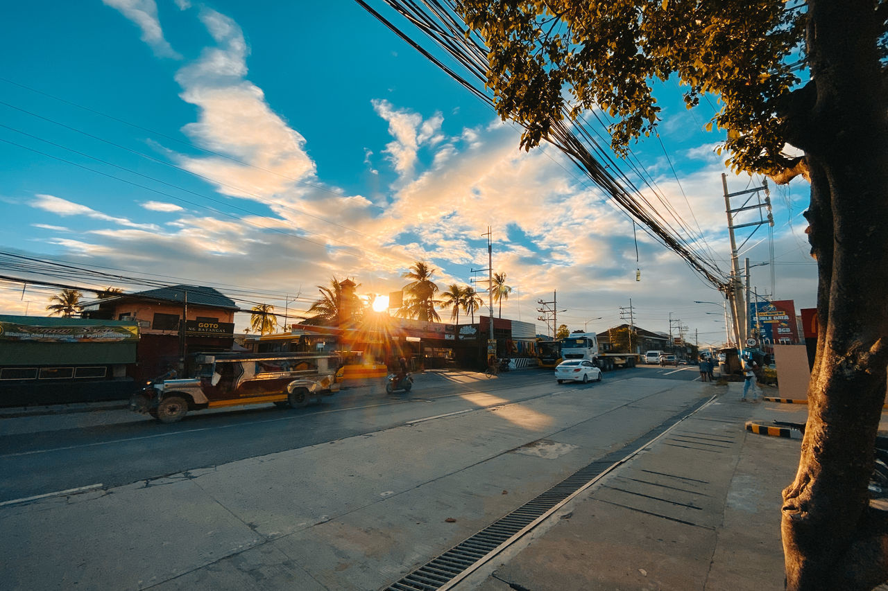 VIEW OF CITY STREET DURING SUNSET