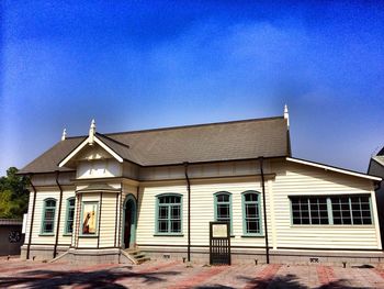 Low angle view of building against blue sky