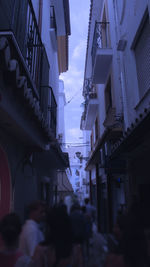 View of narrow street along buildings