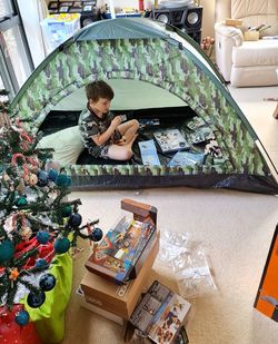 High angle portrait of boy sitting at home