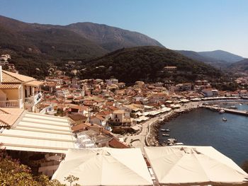 High angle view of townscape and mountains against sky